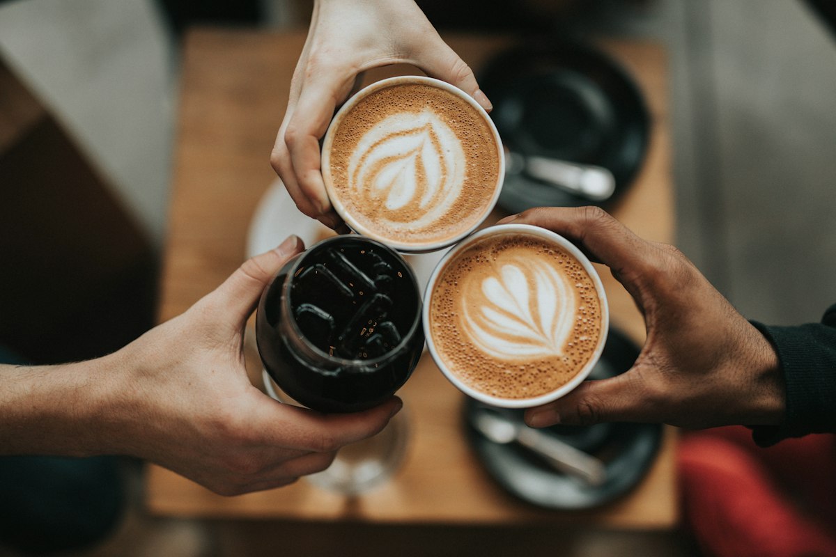 Fresh coffee being handed over the counter